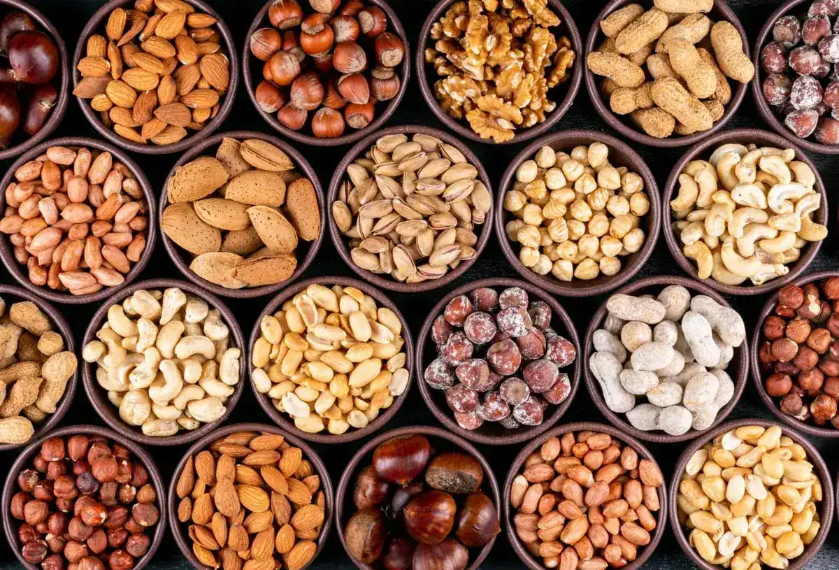 Almonds, walnuts, pistachios, cashews and other nuts in bowls
