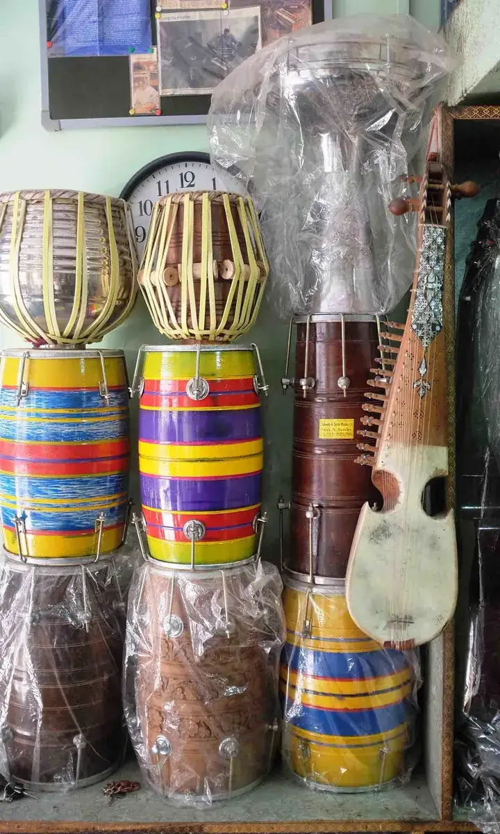 Hand painted dholak drums, tabla and a rabab in a music shop