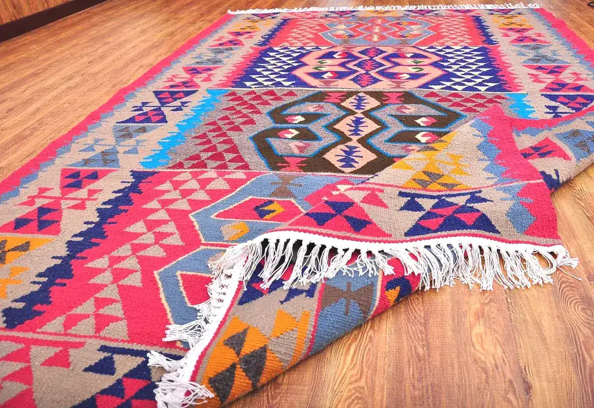 Handwoven kilim rug with a bright geometric pattern