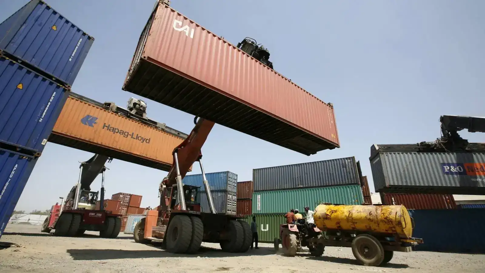 Shipping container being lifted in a container yard
