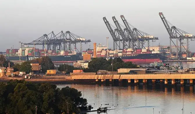 Container cranes at a busy harbor