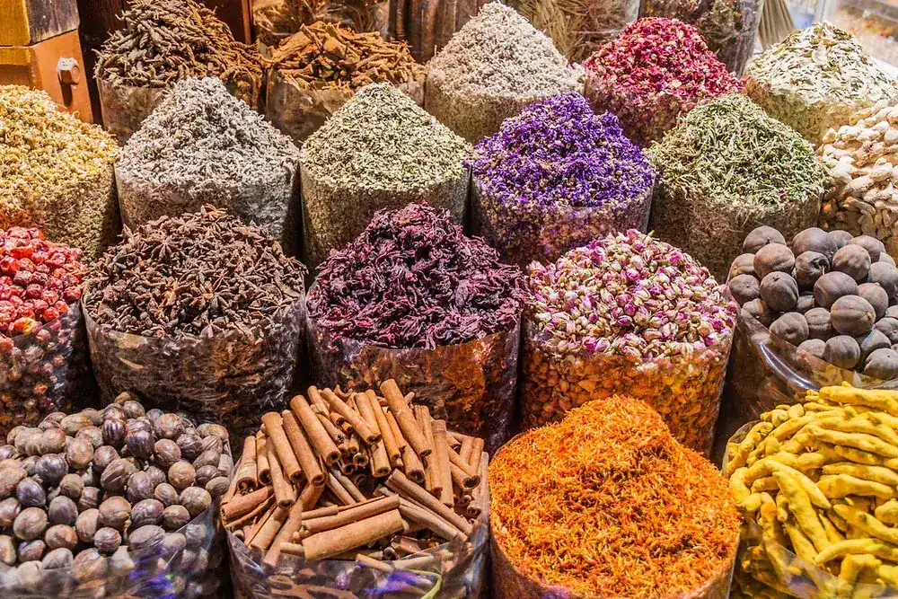 Whole spices, dried flowers and herbs in open sacks